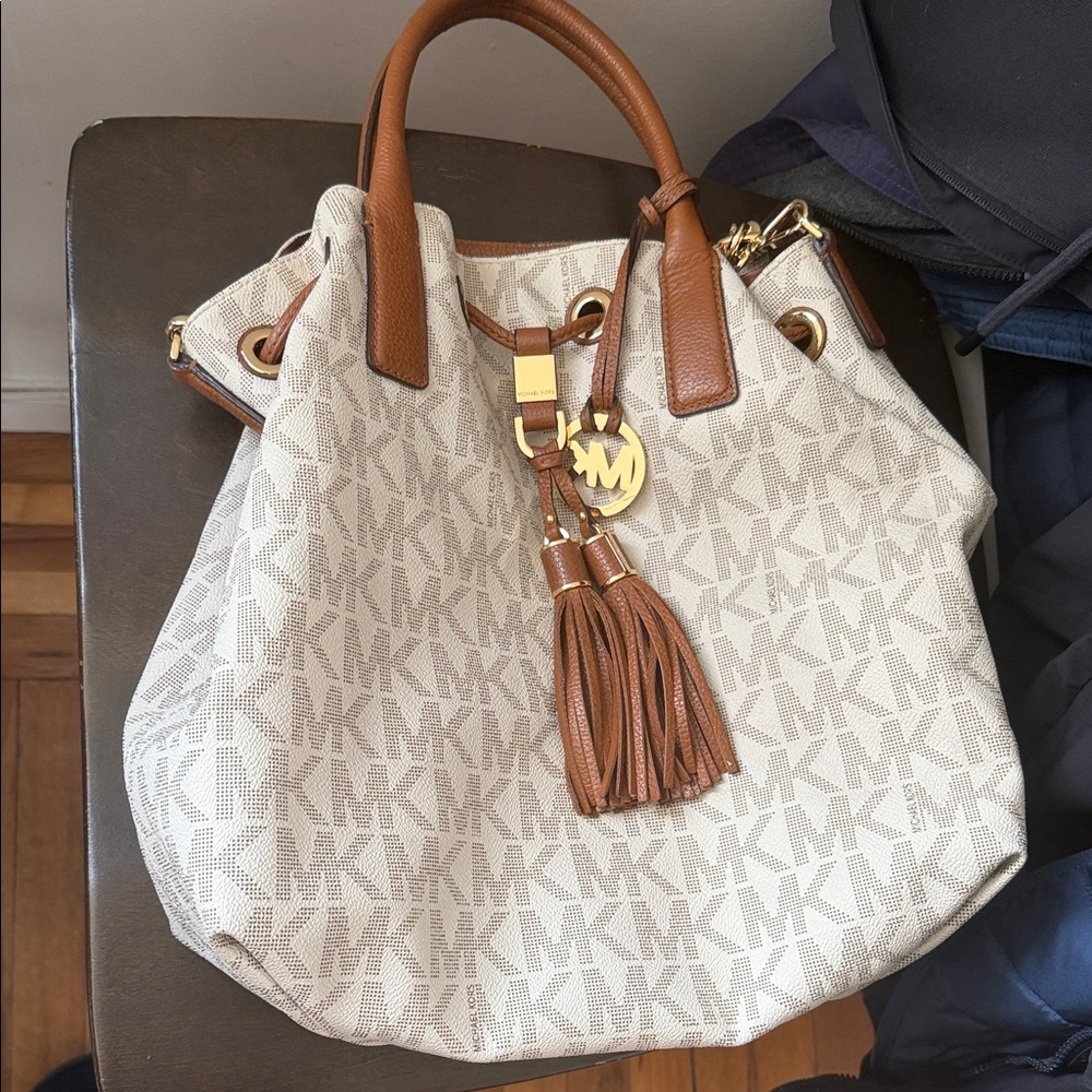 Michael Kors Cream Signature MK Drawstring Hobo with Brown Trim and Tassel